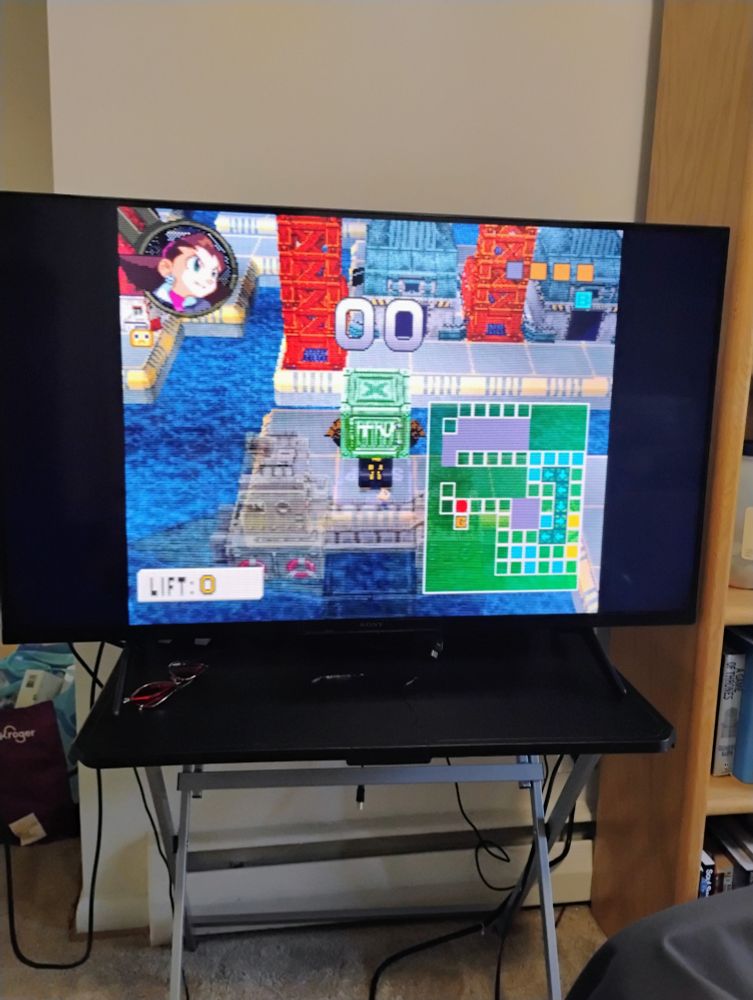 Tron's machine is about to load a ship with the last required crate.