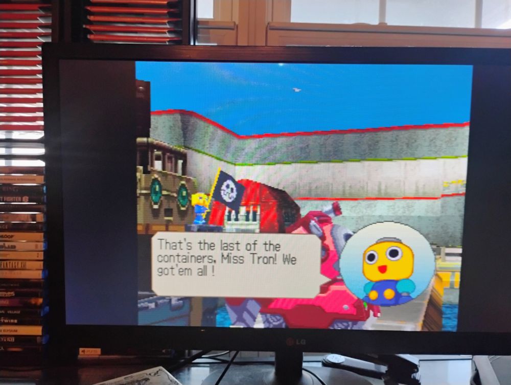 A servbot saying "That's the last of the containers, Miss Tron! We got 'em all!" A red robot is in the background.