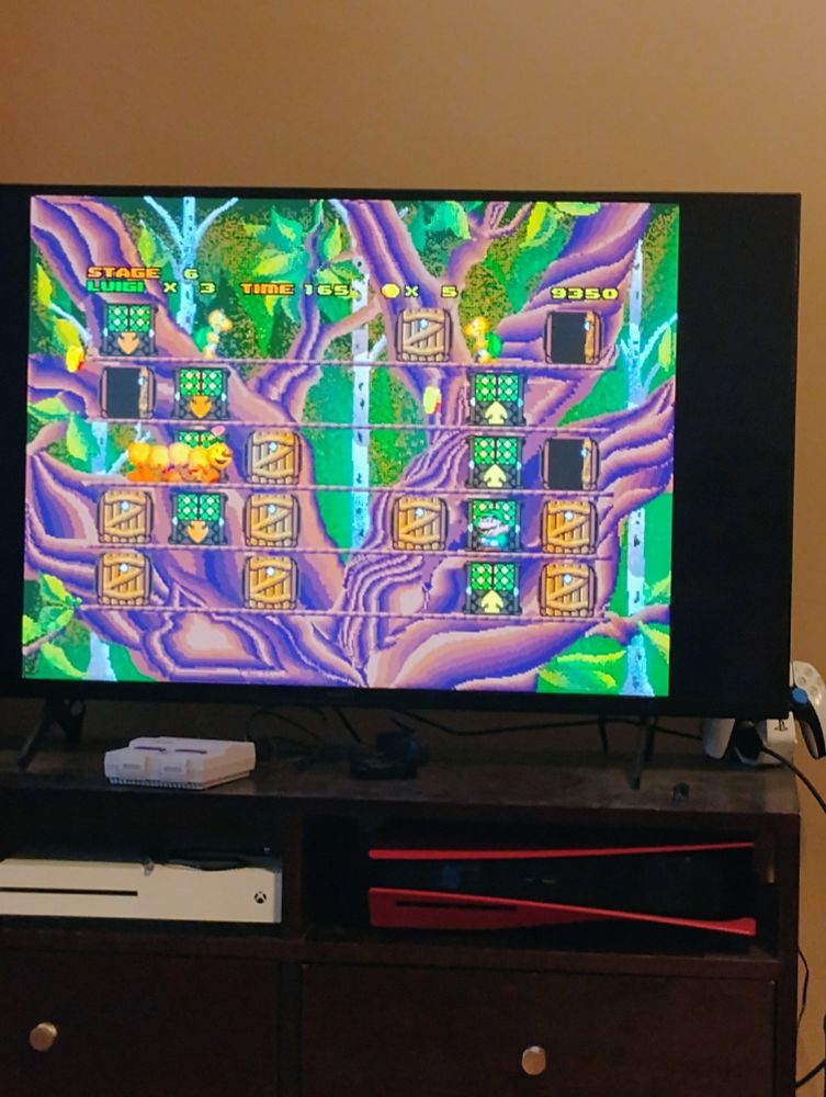 Scene of Hotel Mario for the Philips CD-i, featuring a tree hotel with doors, koopa troopas, and a wiggler.