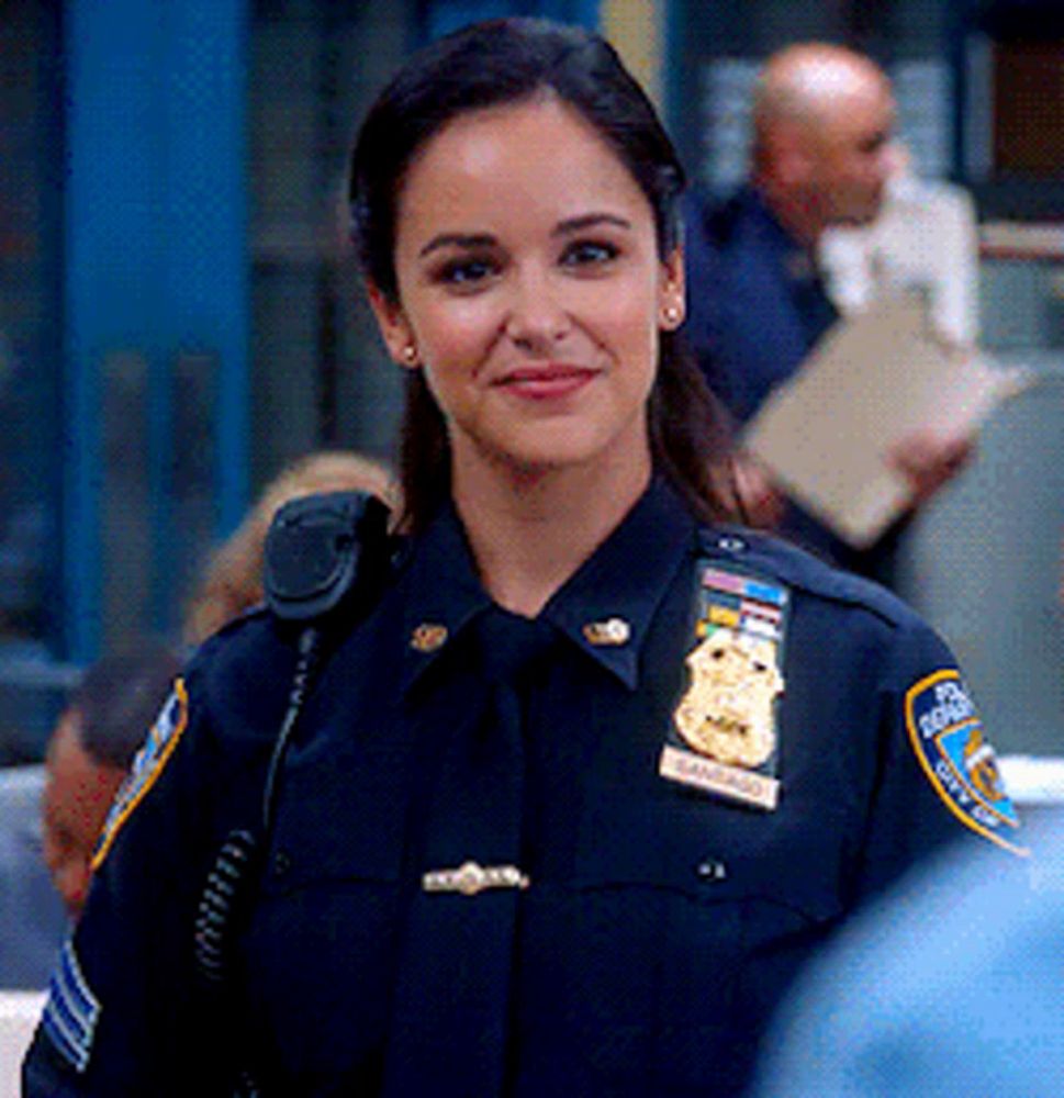 a woman in a police uniform with a badge that says ' new york city police ' on it