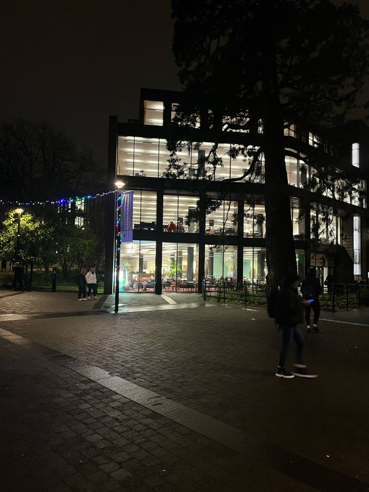 Boole Library at night. Internal light of the building lighting up outside the library 