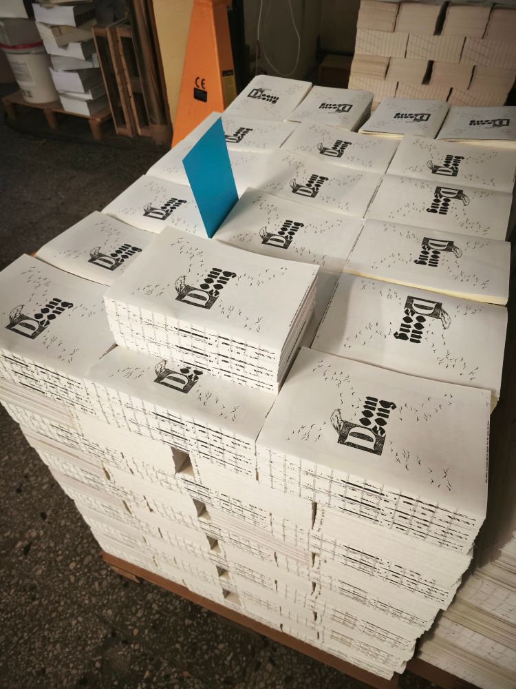 Internal book blocks of the Doomsong RPG, all nearly pulled in a pallet. 
