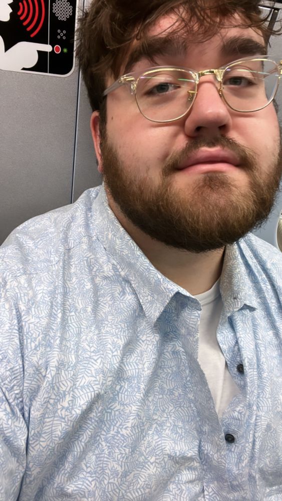sassy gay boy serves cunt on the New York City subway, in selfie photo. 