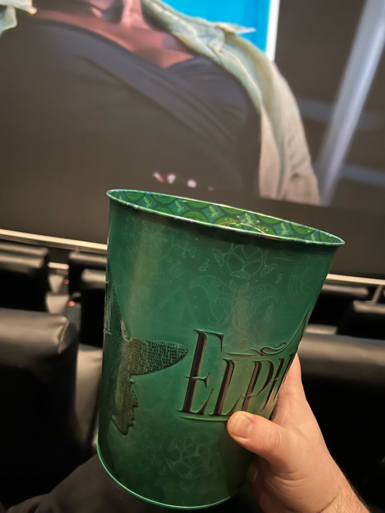 Green popcorn tin serving Elphaba realness for the Wicked film, released by AMC Theaters. This gay guy spent $20 on it. 