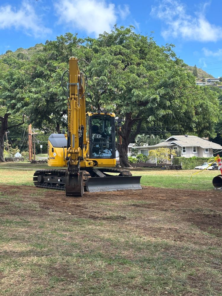 Yellow and black skid steer mini digger