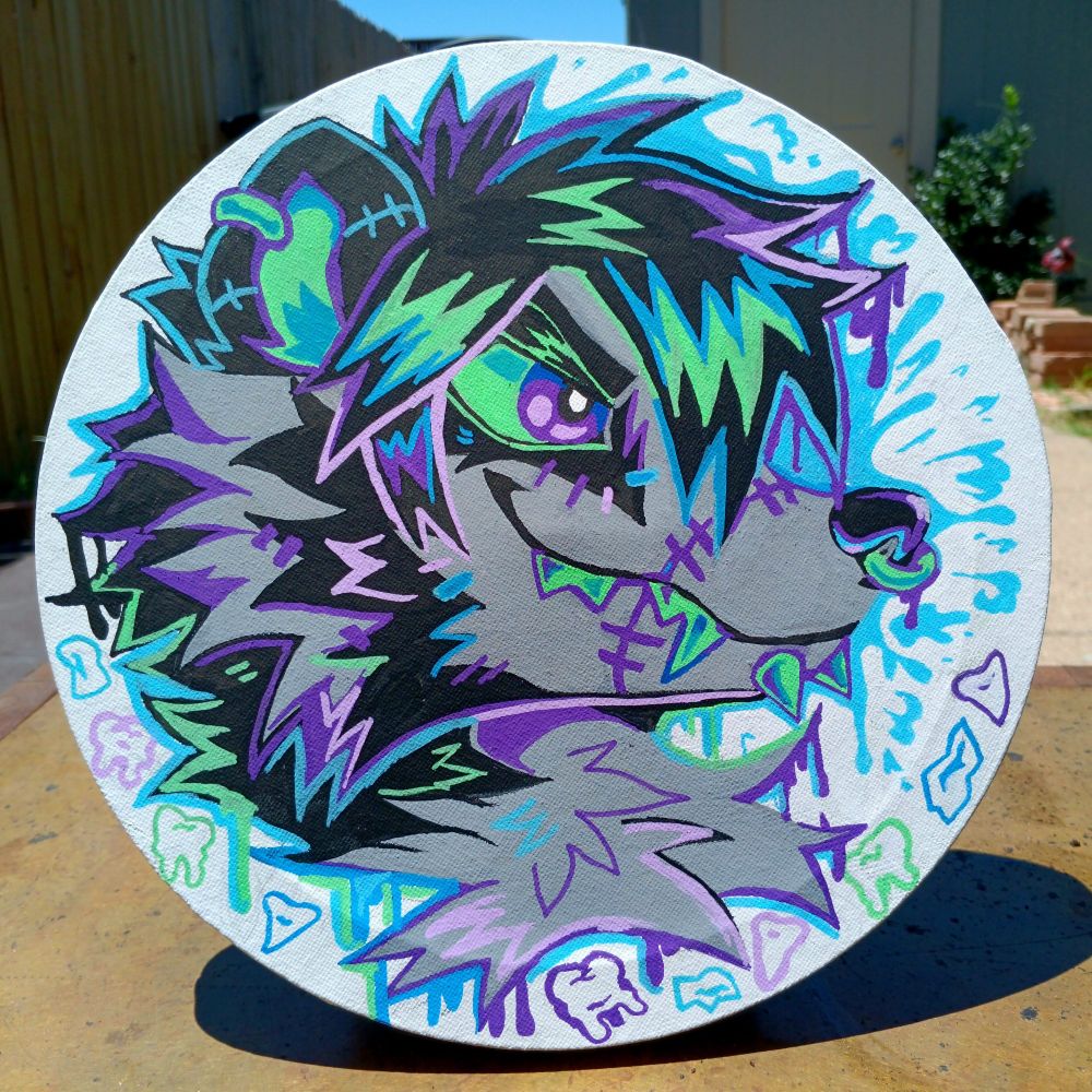 A traditional profile illustration of an anthro  raccoon looking confident. They have messy black hair and various stitches all over their face. They have green teeth and eyes with purple pupils. There are drippy marks from the raccoon with teeth drawn around the bottom of the circular canvas.