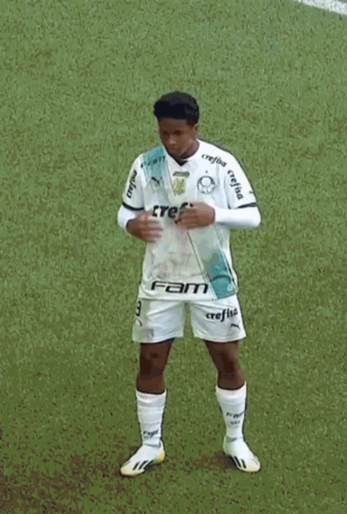 a man wearing a white jersey with the word avanti on the front