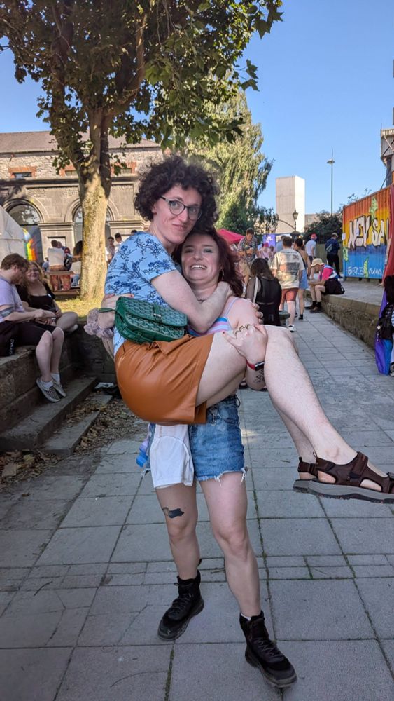 My buddy Nell bridal-carries me! She's grimacing but she's doing it