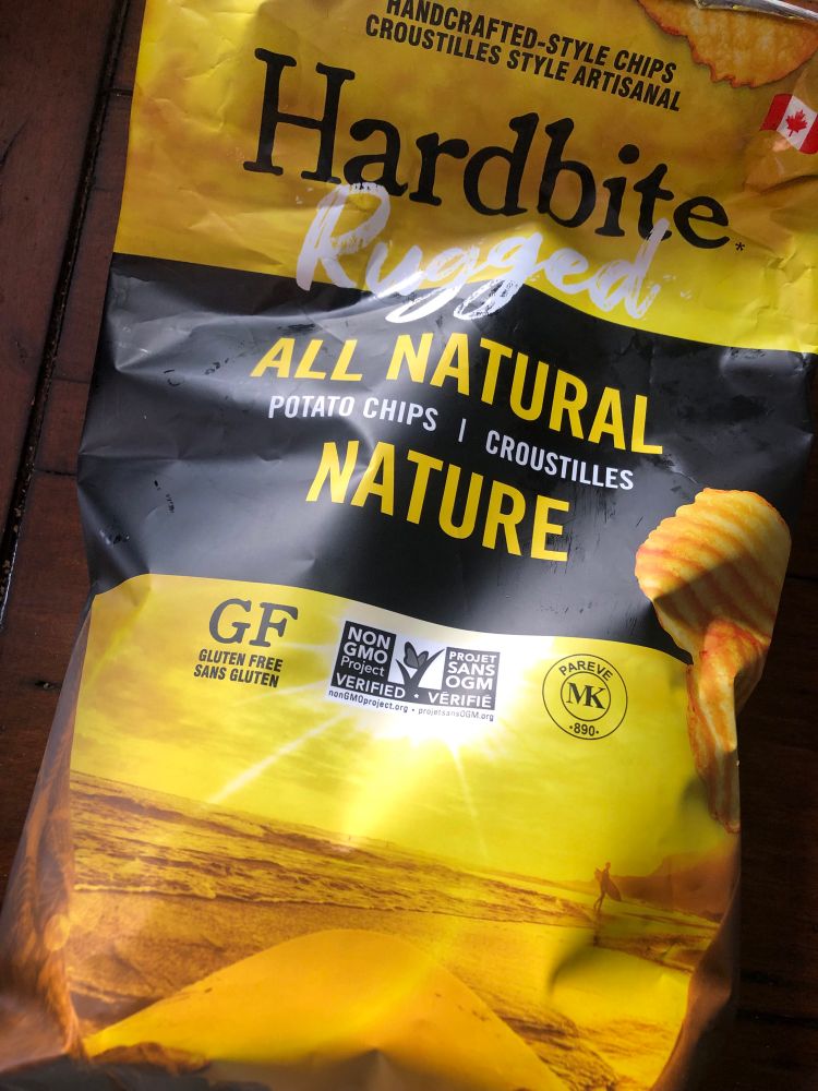 A bag of hard bite chips, half-eaten. 
