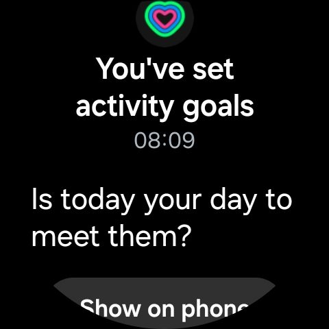 Image of a smartwatch face showing the text "You've set
activity goals. 
Is today your day to
meet them?"