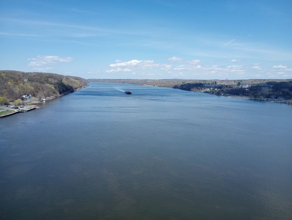 View from the walkway over the Hudson face North with a barge going down river.