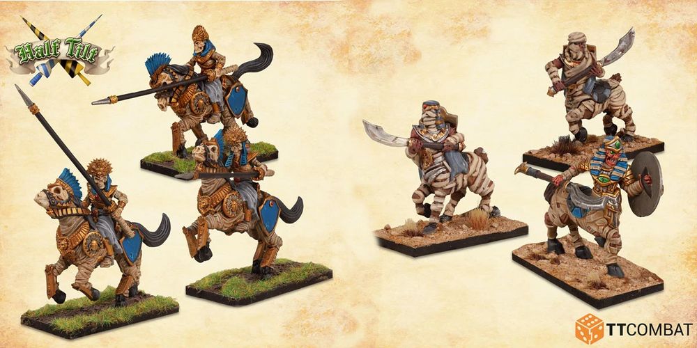 A trio of centaur mummies is depicted, each mounted on a horse-like creature, showcasing intricate details and vibrant colors. The mummies are adorned with ancient armor and wield weapons, with one holding a curved sword and another a shield. The base features a sandy terrain with tufts of grass, enhancing the desert theme of the scene.