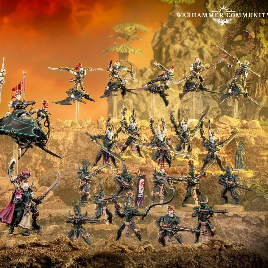A dynamic display of Drukhari miniatures showcases a variety of figures, including the prominent Archon Lady Malys in the foreground, wielding a barbed longsword. Surrounding her are several lethal lieutenants and warriors, each adorned with intricate armor and weapons, set against a dramatic backdrop of rocky terrain and a fiery sky. The scene captures the essence of the Drukhari's dark and menacing aesthetic, highlighting their agility and deadly prowess in battle.