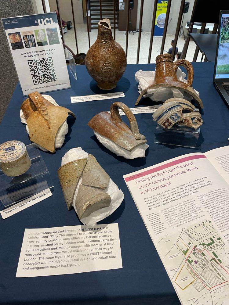 Close up of some of the archaeological pottery fragments, including one with a bearded face on it.