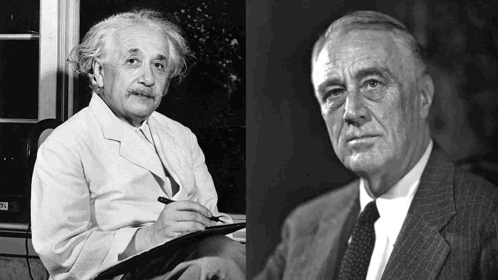 Black-and-white photos of Einstein and FDR.  Einstein is on the left and wears a white suit.  He holds a pen poised to write in his right hand.  FDR is on the right and has a dark tie and dark pinstripe suit