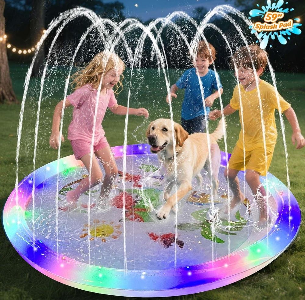 Light-up splash pad with kids & yellow lab frolicking atop 