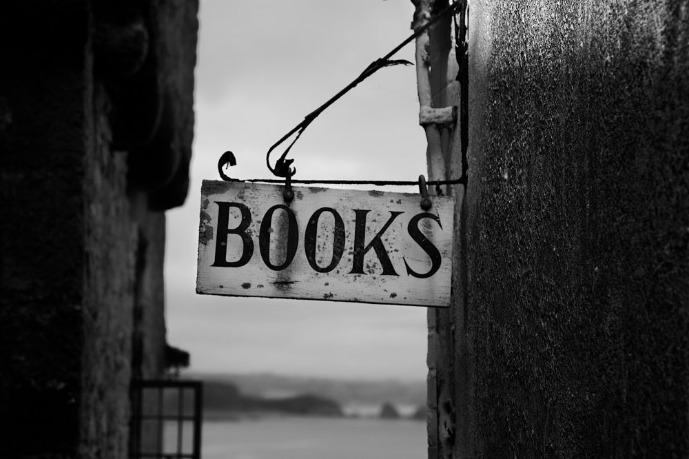 An old-fashioned sign for a bookstore.
