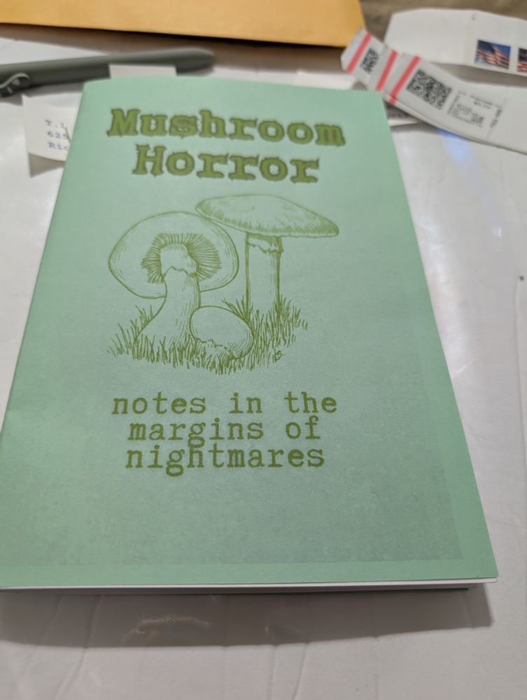 A half zine titled "mushroom horror". Inside is an original short story, a brief essay, and an interactive activity. 