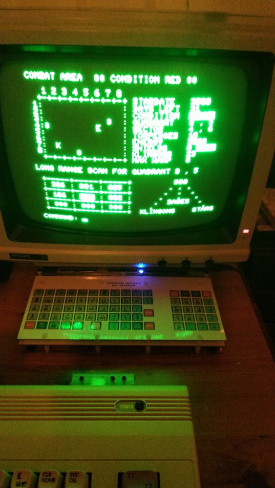 View of green screen CRT monitor sitting on top of my mini pet computer. Game displayed is my Super Star Trek.