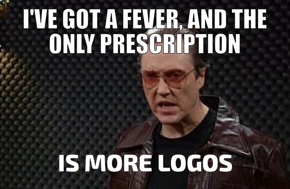A meme of the famous SNL sketch with Christopher Walken about cowbells. 

Text is imposed upon it to say 

"I've got a feever, and the only prescription is more logos" 