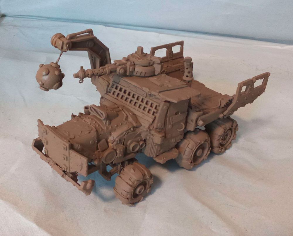 An Ork Trukk modified with new weapons and an enclosed cab. Primed.