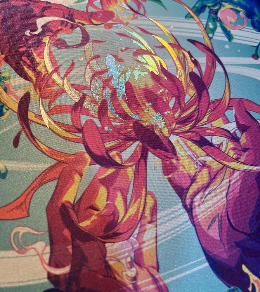A close up of a foil playmat depicting two hands holding a glowing flower. 