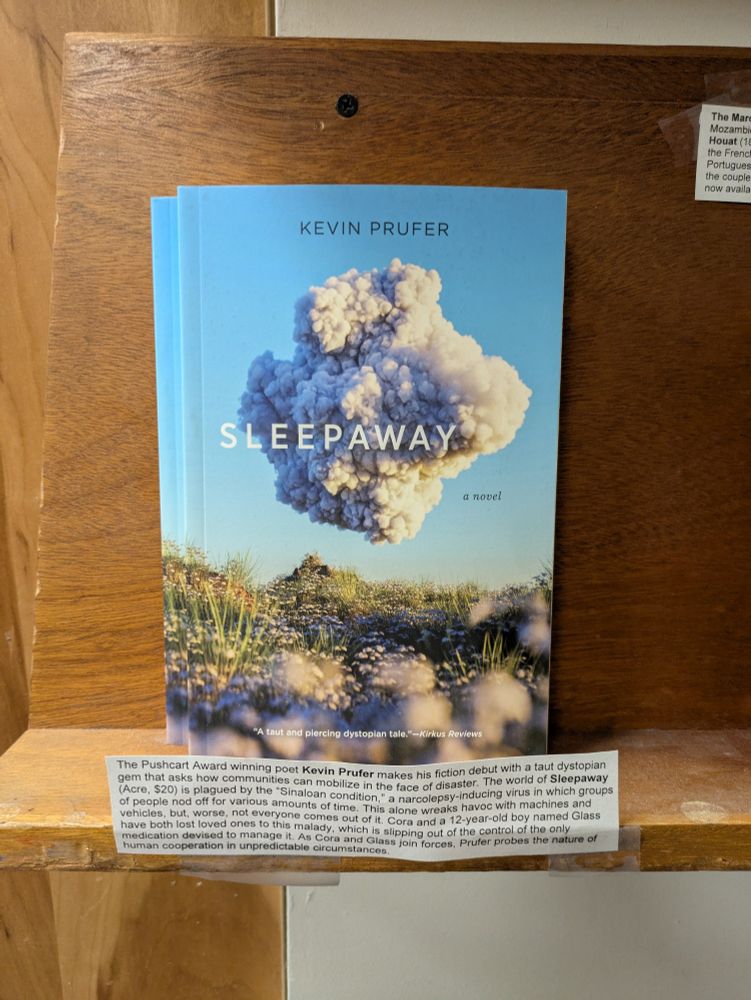 Kevin Prufer's novel, SLEEPAWAY, on a bookshelf. 