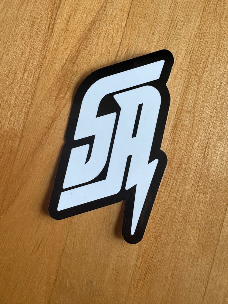 A sticker of a stylized logo featuring the letters “SA”