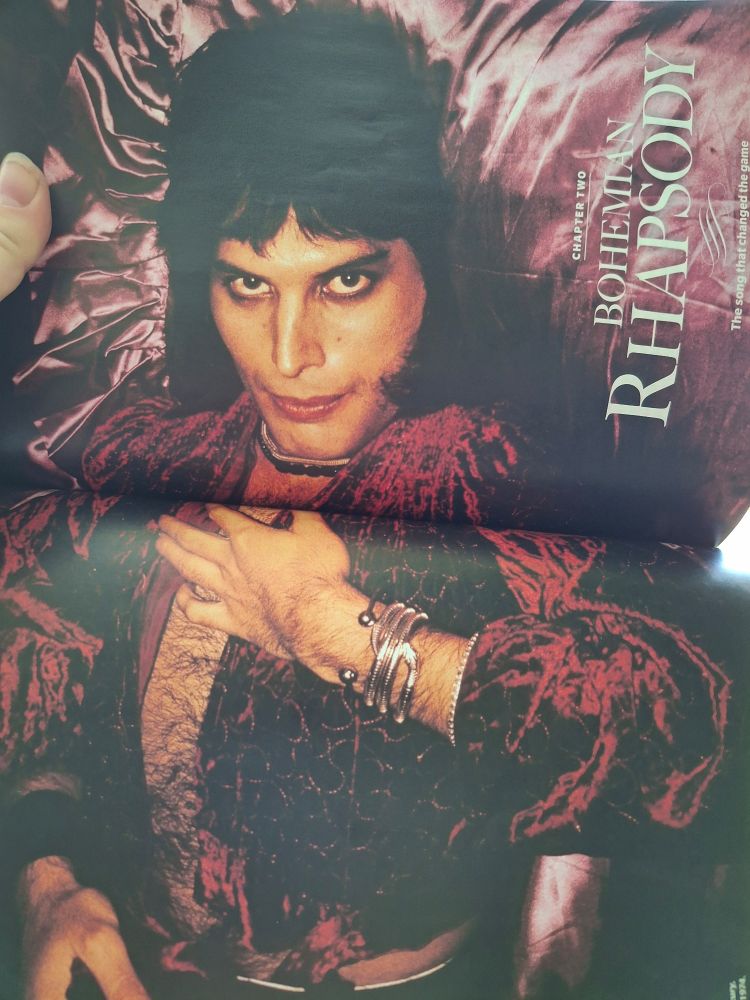 A two-page magazine spread titled "Bohemian Rhapsody" features a long shot of a young Freddie Mercury in burgundy crushed velvet, casting a smoldering gaze at the viewer. 