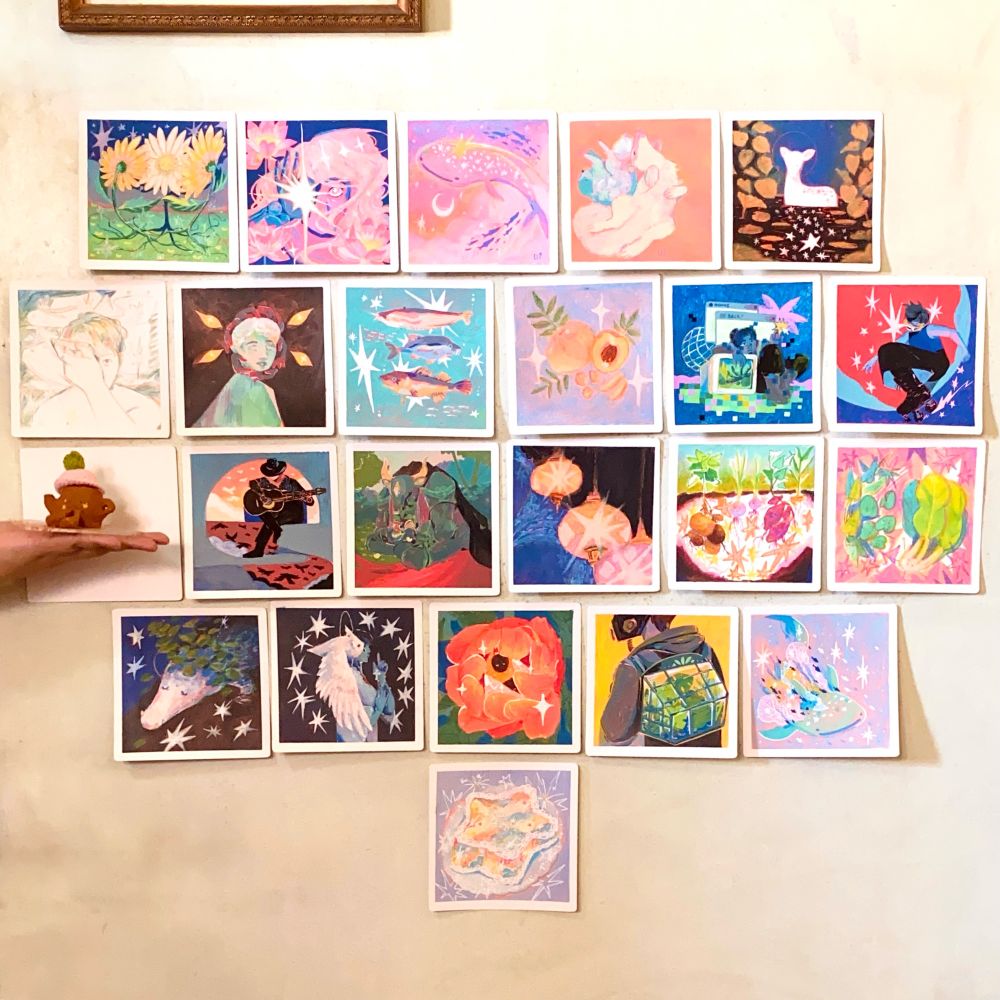 My peachtober artworks posted up on the wall (the teacup friend I made with airdry clay is held up by me from the side, off-camera)