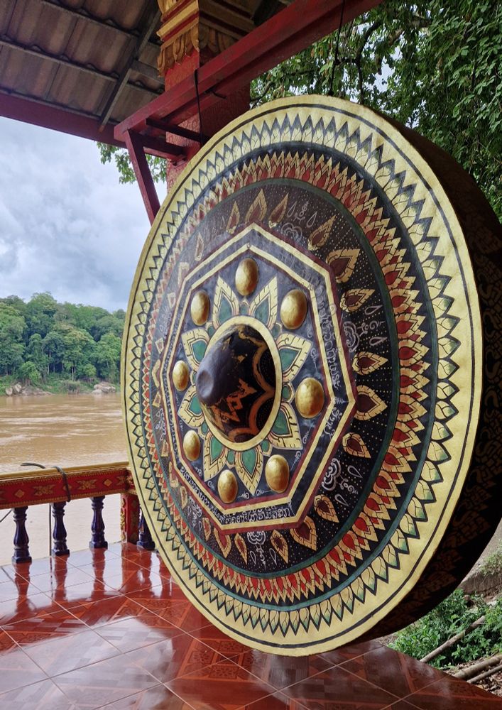 Massive painted gong in a Buddhist temple along Mekong River near Vientiane, Lao