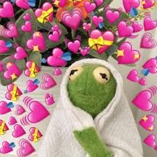 kermit in a white blankie, surrounded by heart emojis