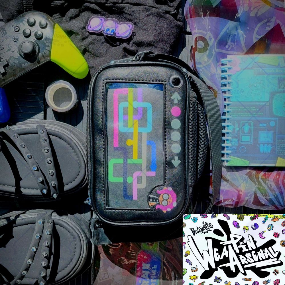 The 'Octo Expansion' variant of my Essentials Ita Bag, surrounded by clothing and props, including some of my other merch. On the bottom right corner is the graphic for BUGSLAP's WeaPin Arsenal