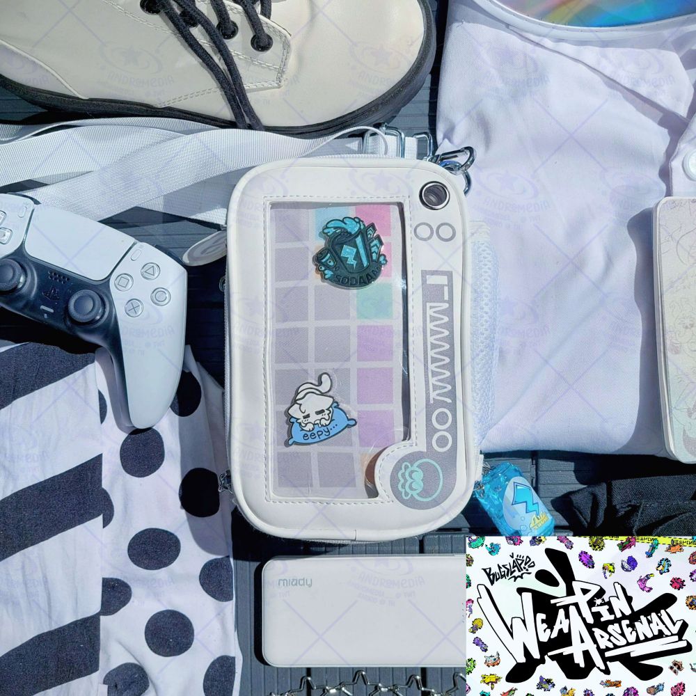 The 'Side Order' variant of my Essentials Ita Bag, surrounded by clothing and props, including some of my other merch. On the bottom right corner is the graphic for BUGSLAP's WeaPin Arsenal