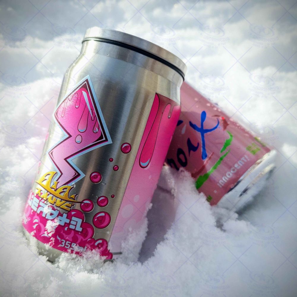 A close-up shot of a tacticooler can in the pink variety. It's being sat up in the snow, leaning up against a pink La Croix soda can.
