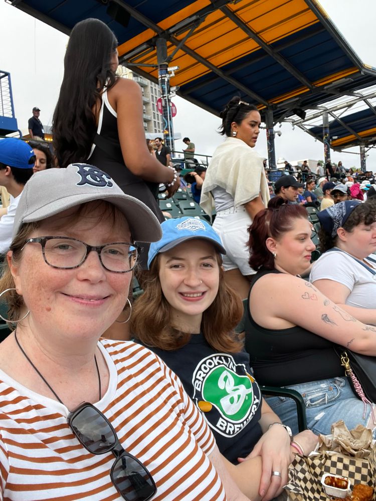 Women sitting in the stands at the Cyclones baseball game 