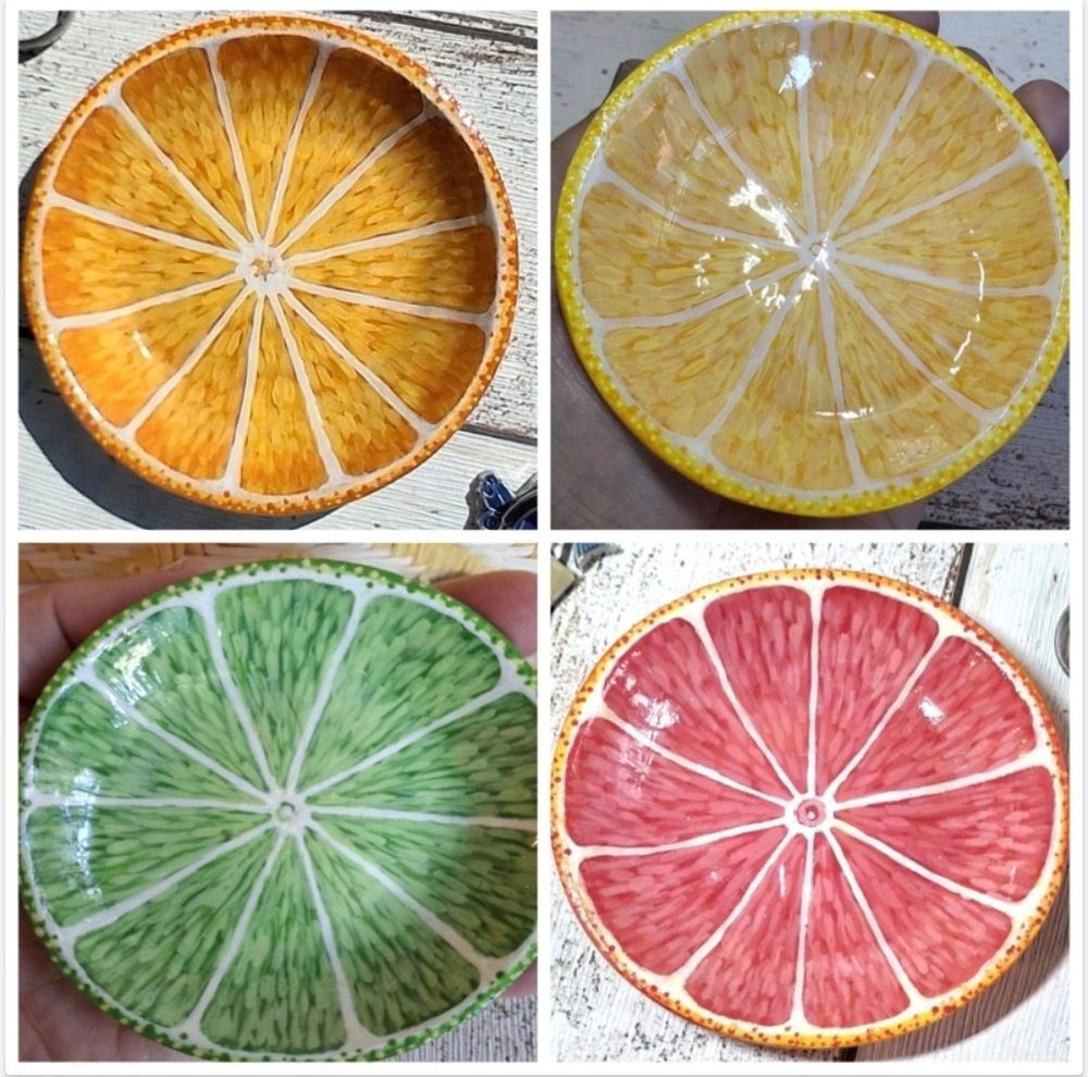 The image shows a screen split in four with each of my handmade and hand painted, citrus trinket dishes in each quarter. The four quarters each contain a different citrus fruit half dish, rendered in clay. Top L is an orange Top R a lemon. Bottom L a lime and bottom R a pink grapefruit.