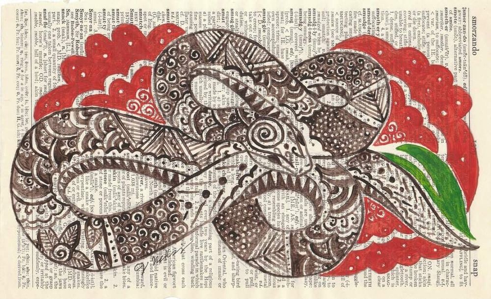 A sepia zentangles snake curls on itself, forming two infinity signs. 3 stylized red flowers and a single green leaf accent around the snake. It is painted on a sideways, onion skin dictionary page featuring the word "snake". 

When I was a kid, I collected and read dictionaries like any other book. In 2013, I came across the box in storage. I had over a dozen dictionaries in there, languishing. I decided to upcycle my old dictionaries. 

When I finished painting my snake, my oldest walked into the room and said, "Momma! Is that a Goddess Snake?!" with absolute wonder in his voice. 

I gave him a hug and said, "It is now!"