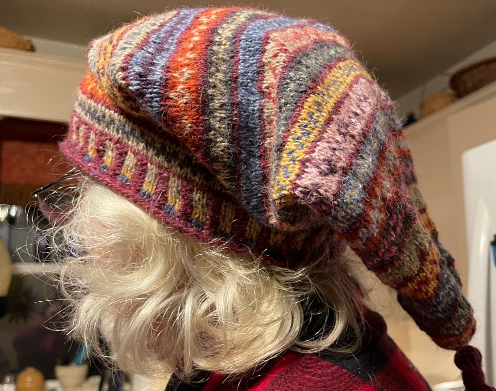 Long stocking cap in fair isle colorwork. 