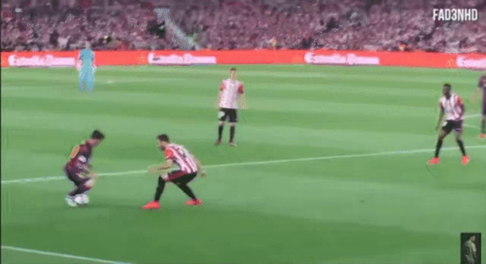 a man is taking a picture of a soccer game with the number 10 on his jersey