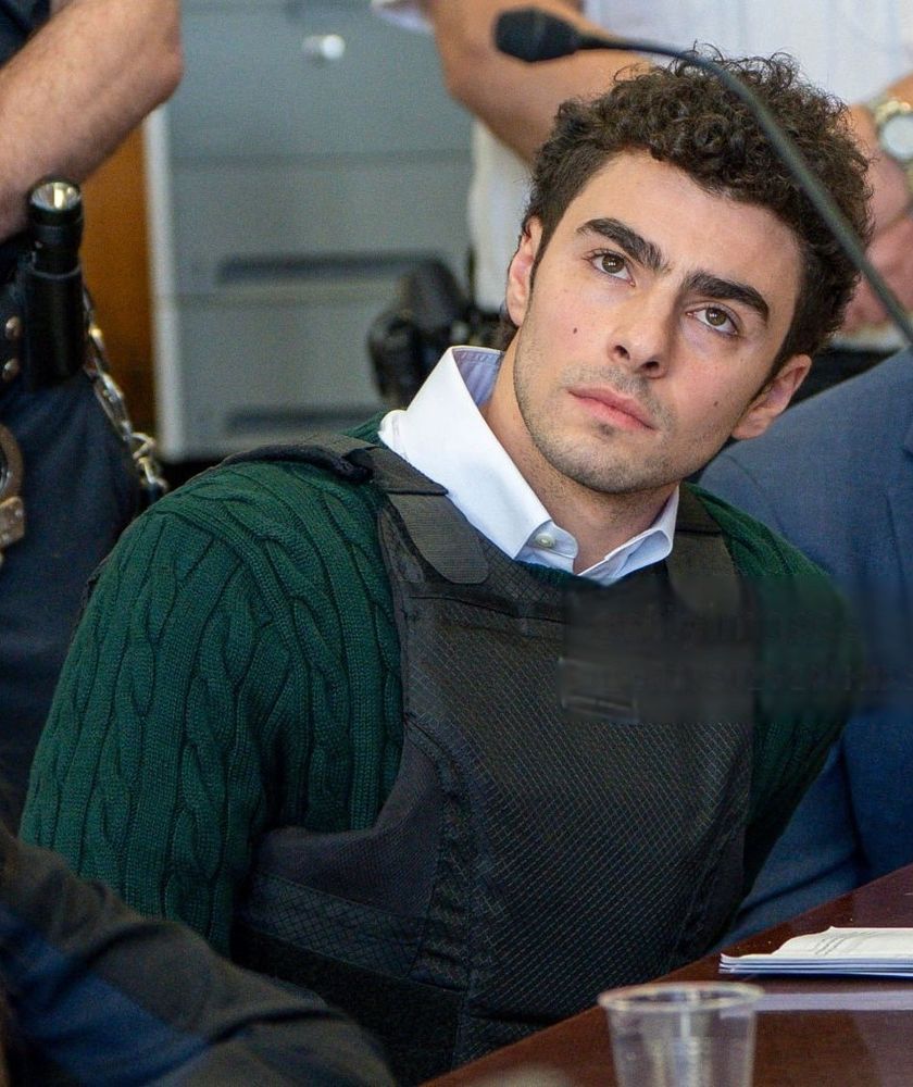 Luigi absolutely serving in a green sweater with a white collar shirt under it and bullet proof vest. We Stan a morally grey man in this household