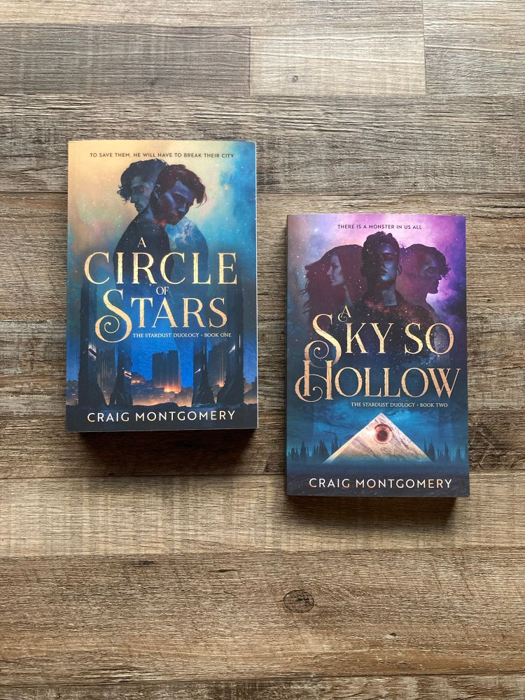 Wood panel background, two books, A Circle of Stars and A Sky So Hollow by Craig Montgomery