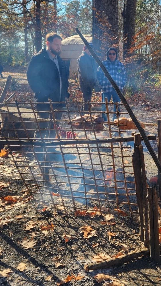 A goose and a duck on a spit over a fire. Hanging near the fire, barely visible unless you zoom in, are some slices of venison we’re smoking. The Powhatan didn’t have ready access to salt, so smoking was pretty much the only way they had to preserve meat in the 17th century. Fruits and vegetables were typically sun-dried.