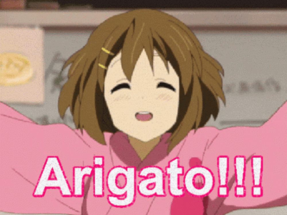 a girl with her arms outstretched says " arigato "