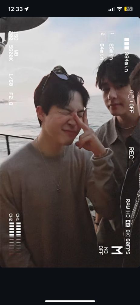BTS Jimin making a cute face holding up a peace sign against his eyes 