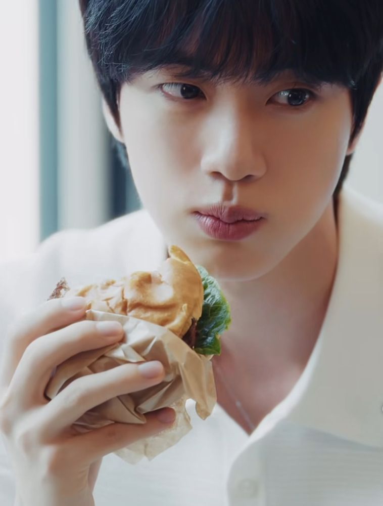 BTS JIN eating a burger 