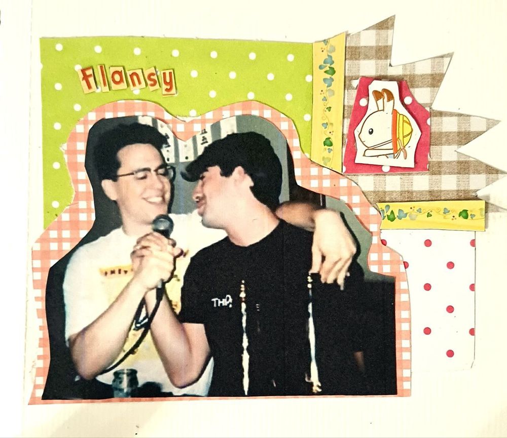 A page with a picture of John Flansburgh singing karaoke and hugging a man over colorful paper
A picture of a Sylvanian Families calico critter next to it
Letters spelling "Flansy" over the picture