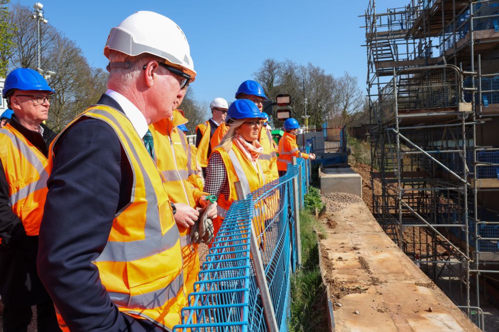 People overlooking a construction site.