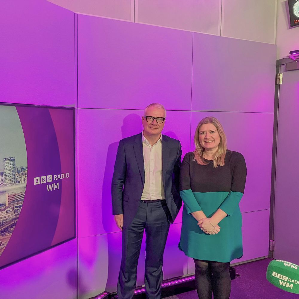 Richard Parker standing with BBC Radio West Midlands Senior Radio Presenter, Kathryn Stanczyszyn, in the BBC Radio West Midlands studio.