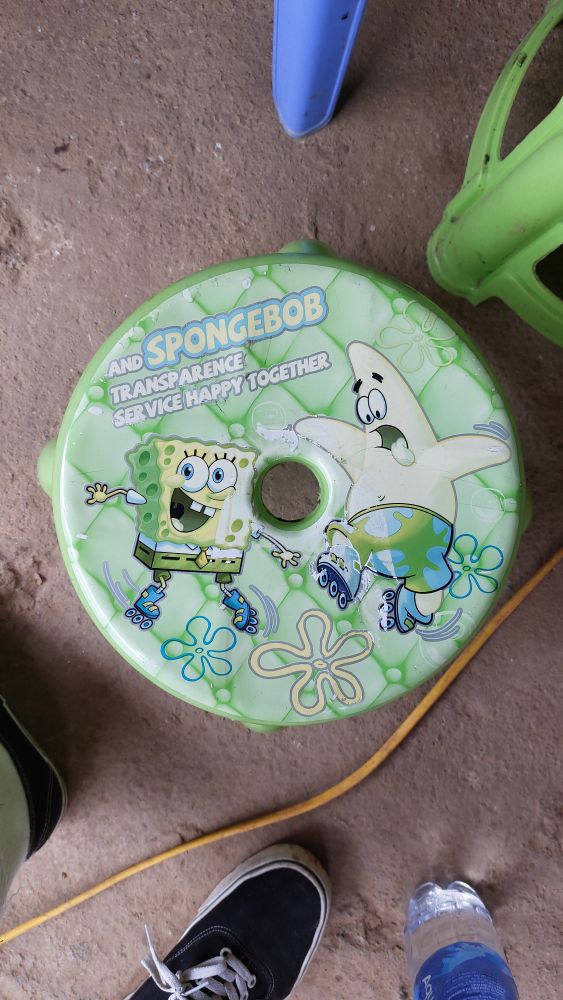 A stool with spongebob and patrick in rollerskates saying "And Spongebob Transparence Service Happy Together"